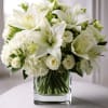 Elegant White bouquet filled with white roses, white lilies, white carnations and