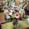Gerbera daisies, lisianthus, snapdragons, stock, spray roses &amp; larkspur in a clear