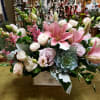 A variety of pink flowers including: Lilies, roses, spray roses, lisianthus &amp;