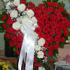 Red Carnations ,Touch of White Roses, Eucalyptus, Assorted Fancy Greens, Babies-Breath, 