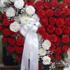Red Carnations ,Touch of White Roses, Eucalyptus, Assorted Fancy Greens, Babies-Breath, 