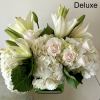 Arrangement of white Roses, Hydrangeas, Lilies and other flowers. Arranged in a