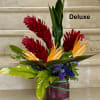Tropical Flowers as shown arranged in a vase. Deluxe version has more