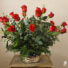 Two dozen (24) premium long stem red roses in a basket. Send
