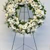 A beautiful white and green tribute wreath that calms, this easel arrangement