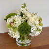 Adorned in a chic glass cylinder vase, this stunning arrangement blends the
