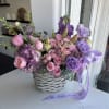 This floral arrangement from Purple Mood features a lush and romantic mix