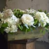Each arrangement is custom designed, using seasonal, best-of-day blooms. The image shown