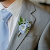 A classic white boutonni&egrave;re that compliments any suit. A perfect addition for