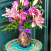 Lavender lilies and roses to brighten any room! 