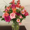 Happy includes alstroemeria, roses, and gerbera daisies which makes  "Happy" a