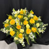 Surround your loved one with a radiant embrace of golden flowers in
