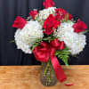 Blushing Beauty, a stunning arrangement of one dozen red roses and soft