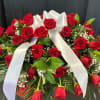 Red roses, the timeless symbol of love and affection, offer a poignant