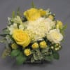 This sparkling array of sunny favorites in a cube vase will be