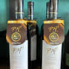 Papi Pinot Noir is a captivating red wine elegantly presented in a