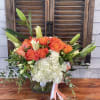 Orange flowers in glas container