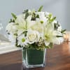 Our sympathy arrangement of angelic white roses, lilies, mums, daisy poms and