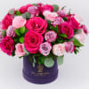 JEWEL TONED ROSES IN LOGO BOX

Bright and Beautiful. A rose arrangement featuring