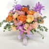 Cute and bright flower arrangement  with a seasonal tones of Orange