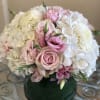 A beautiful low &amp; compact arrangement with white Hydrangeas, light pink Roses