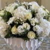 Beautiful combination of white Hydrangeas, Roses, Lisanthus, Stock and other seasonal flowers