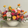A beautiful summer arrangement with Roses, Dahlia, Protea and other seasonal flowers.
****The