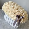 All white roses in our white vase 

Fresh cut roses