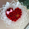 Heart shaped bouquet with 40 roses. Decorated with elegant paper. Saying I