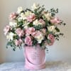 Beautiful pink and white roses in our signature box.