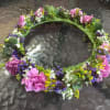 This crown uses a mix of pink / green flowers, and can