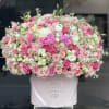 Big pink velvet box with pink and white mixed flowers. 