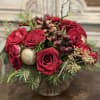 Holiday floral arrangement in a 5x5 bubble ball vase, that will leave