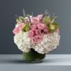This floral arrangement exudes romance and sophistication with a beautiful  blend