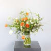 An adorable wild flower style bouquet create by Orange and Ivory tulip