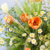 An adorable wild flower style bouquet create by Orange and Ivory tulip