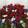 Our choice of flowers arranged into a casket spray.  If you