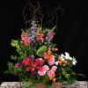 A beautiful tribute of gorgeous, vibrant blooms.  Elegant roses, hydrangeas, snapdragons