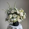 a not so classic Vase elegantly decorated with white flowers, a beautiful
