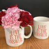 Red roses and carnations in a 14oz ceramic mug. 
Microwave and dishwasher