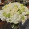This arrangement is packed full of garden roses and complimentary textures that