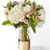 Capturing the essence of a cool spring day, this delicate arrangement is