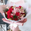 A mix of pink lilies and red roses dressed to impress! 

Note: