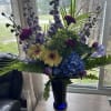 Peacock colors!  Featuring purple, blue, green and yellow. Hydrangea, gerbera daisies