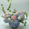 Elevate your floral experience with our unique arrangement featuring a blend of