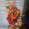 Ribbon vase with Hot pink roses, Orange Lilies and snapdragons 