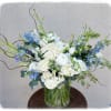 This arrangement is a showstopper. It contains delphinium, ranunculus, roses, Lisi, stock