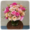 Three dozen assorted pink roses with wax flower.