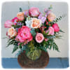This dimple vase has peony, roses, alstroemeria, stock and hypericum.
