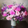Soft pinks and purples gives this arrangements softness.